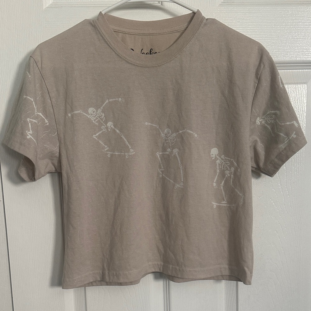 Women’s Tan Graphic Crop Tee with Skateboarding Skeletons